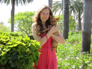 Our daughter with her dog in tropical setting